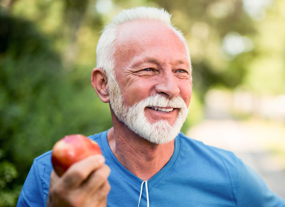 Man holding an apple